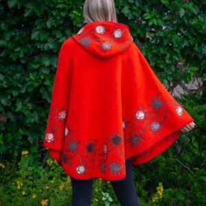 Naiste kootud villane poncho Lotta oranz, kapuutsiga ja vilditud kaunistustega selg